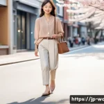 여성용 로퍼 스타일링 - A stylish young Japanese woman walking casually in a city street during spring, wearing soft leather...